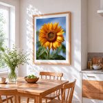 Single sunflower against blue sky cross stitch artwork displayed on wall as home decor