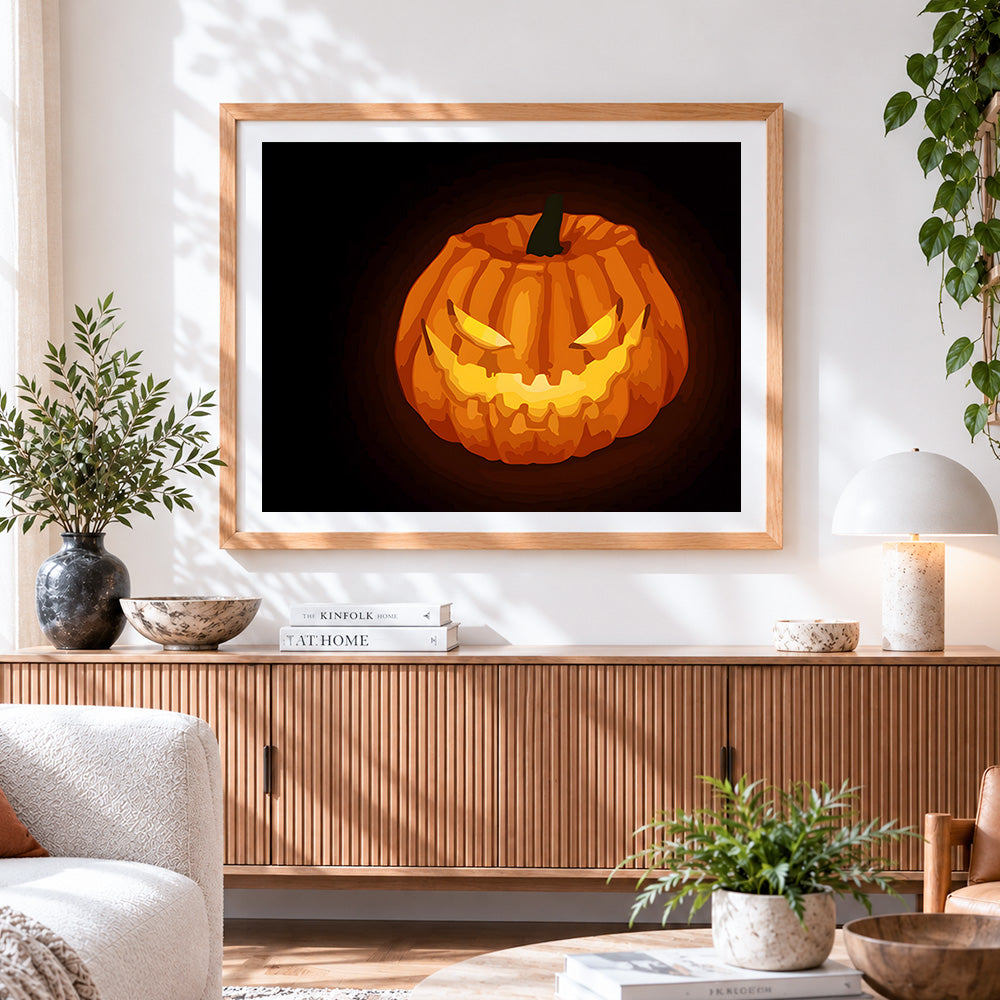 Finished sinister glowing jack o lantern cross stitch artwork displayed
