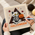 Creating handmade sitting skeleton cat punch needle artwork