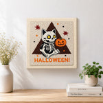 Finished sitting skeleton cat artwork displayed on a wall