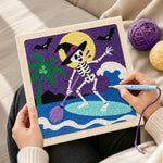 Creating handmade skeleton witch paddle surfing punch needle artwork