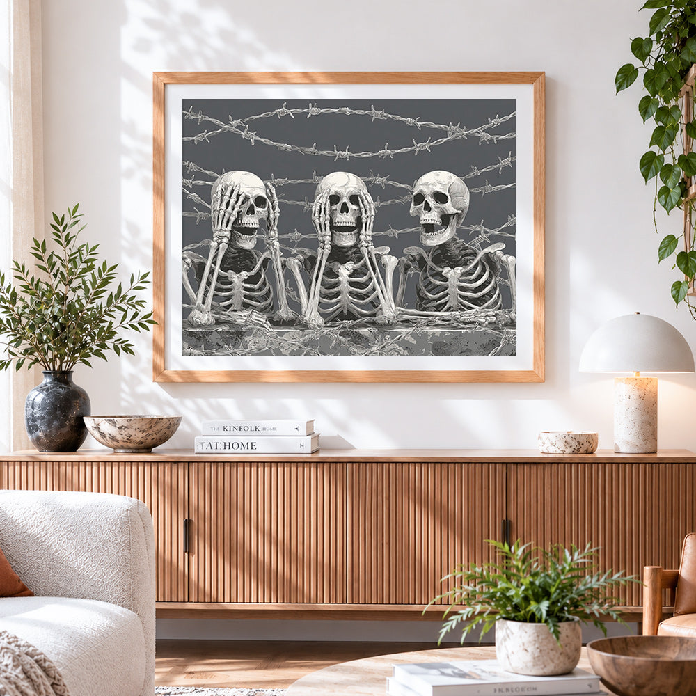 Finished skeletons behind barbed wire cross stitch artwork displayed