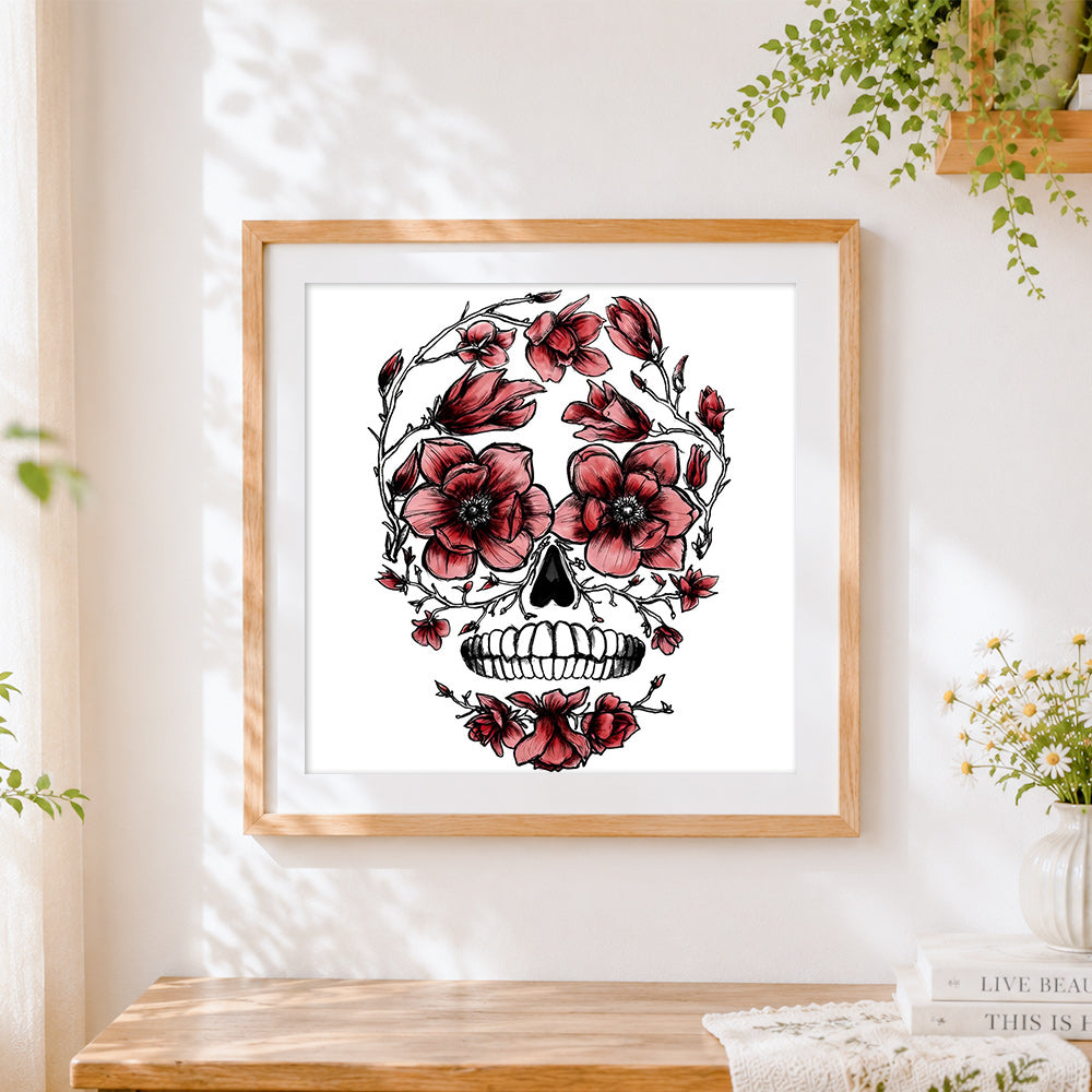 Finished skull adorned with anemones cross stitch artwork displayed