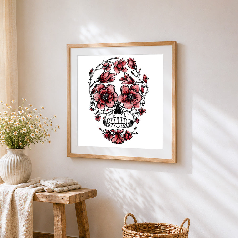 Skull adorned with anemones cross stitch artwork displayed on wall as home decor