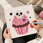 Creating handmade skull cupcake treat punch needle artwork