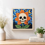 Finished skull flower under starry sky artwork displayed on a wall