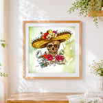 Finished skull in sombrero cross stitch artwork displayed