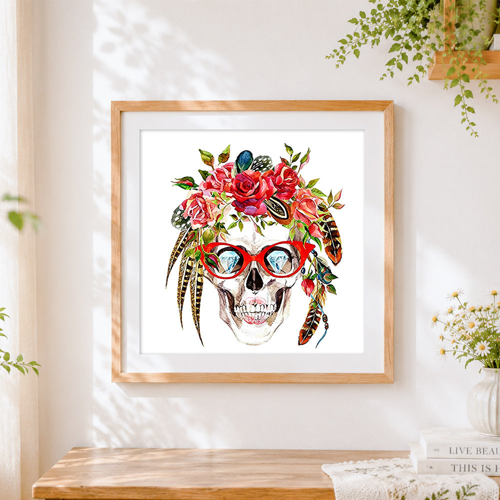 Finished skull with diamond eyes cross stitch artwork displayed