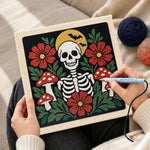 Creating handmade skull with flowers and mushrooms punch needle artwork