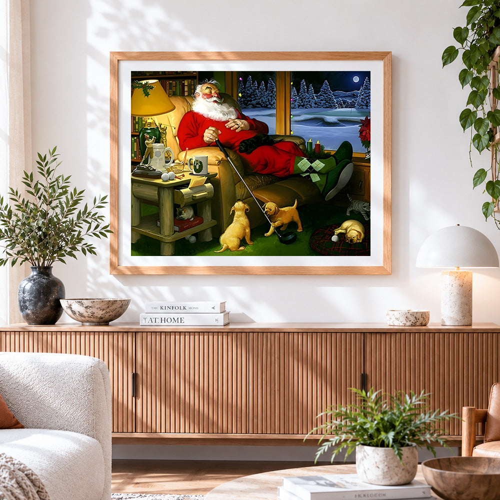 Finished sleeping father christmas with golf club cross stitch artwork displayed