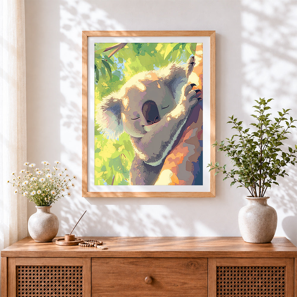 Finished sleeping koala in tree cross stitch artwork displayed