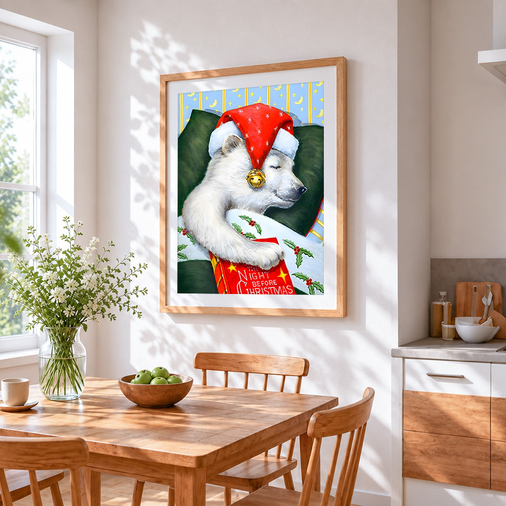 Sleeping polar bear in a santa hat cross stitch artwork displayed on wall as home decor