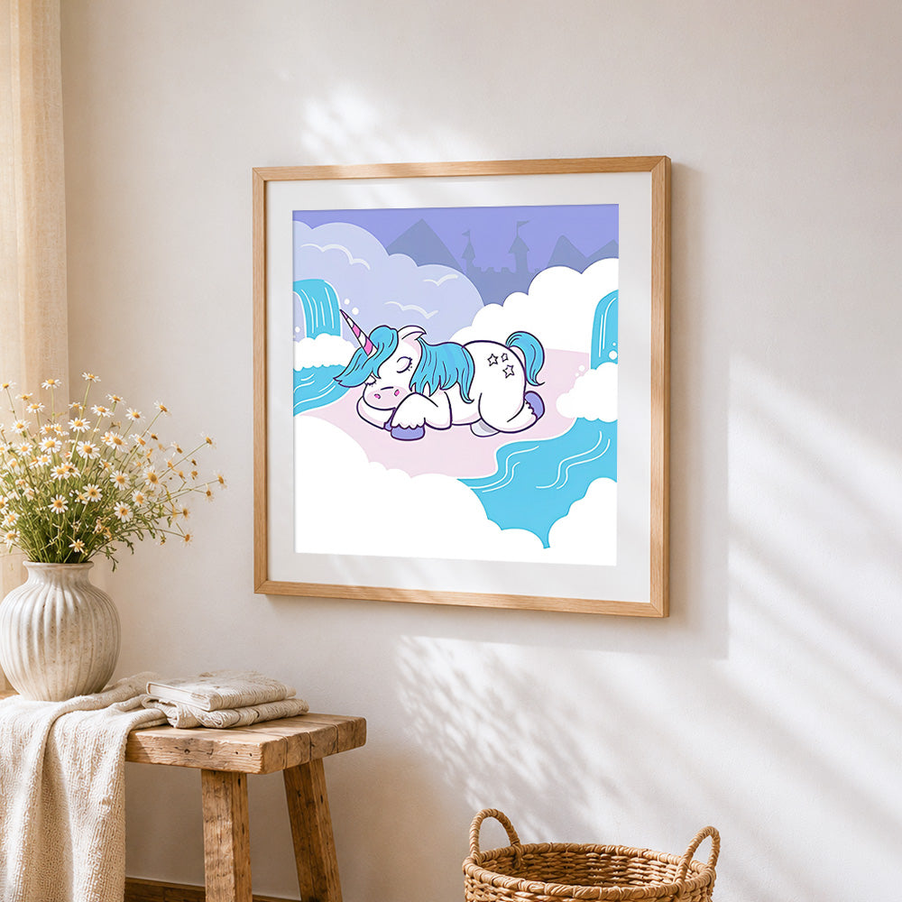 Sleeping unicorn in the clouds cross stitch artwork displayed on wall as home decor