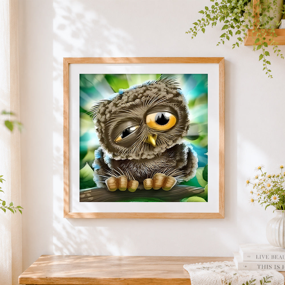 Finished sleepy owl close-up cross stitch artwork displayed