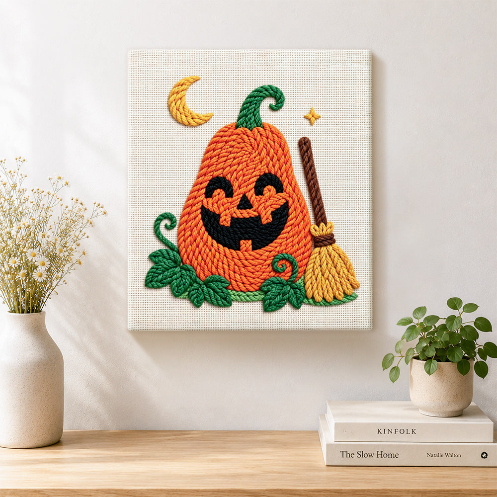Finished smiling pumpkin with broom artwork displayed on a wall