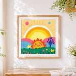 Finished smiling sun and rainbow cross stitch artwork displayed