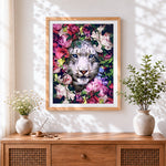Finished snow leopard in flowers cross stitch artwork displayed
