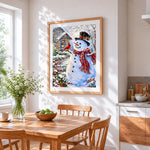 Snowman and cardinal in the snow cross stitch artwork displayed on wall as home decor