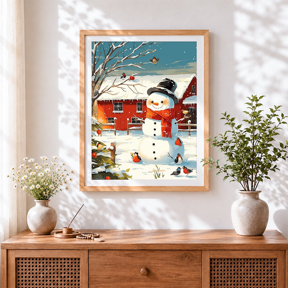 Finished snowman and robins by red barn cross stitch artwork displayed
