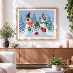 Finished snowman couple with red birds cross stitch artwork displayed