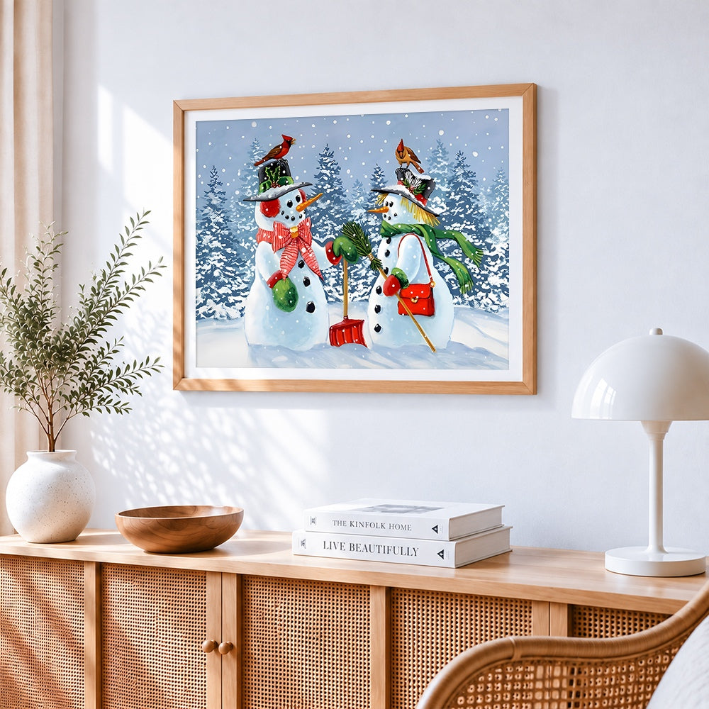 Snowman couple with red birds cross stitch artwork displayed on wall as home decor