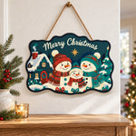 Snowman family with cosy cottage paint by numbers door hanger as indoor wall 