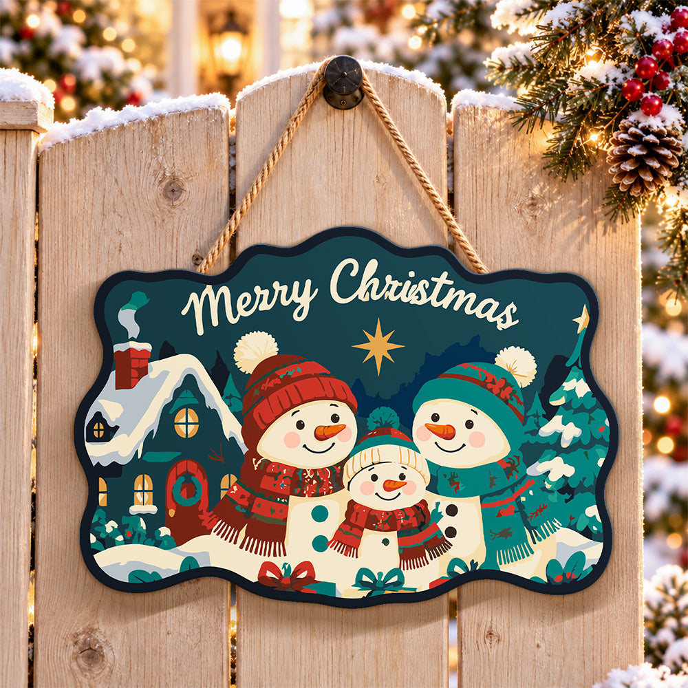 Snowman family with cosy cottage paint by numbers door hanger on a garden gate