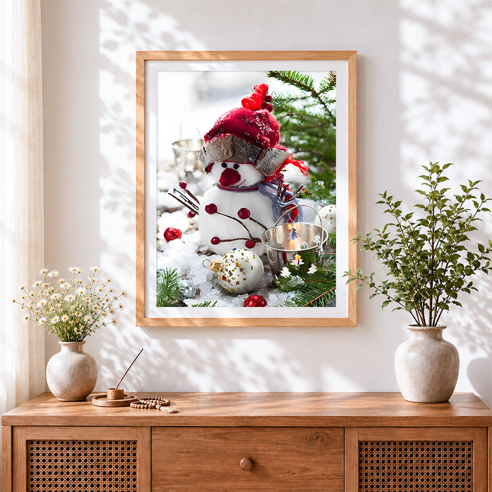 Finished snowman figurine and christmas baubles cross stitch artwork displayed