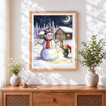 Finished snowman, gnome and robin cross stitch artwork displayed