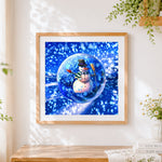 Finished snowman in a crystal ball paint by numbers artwork displayed as home decor