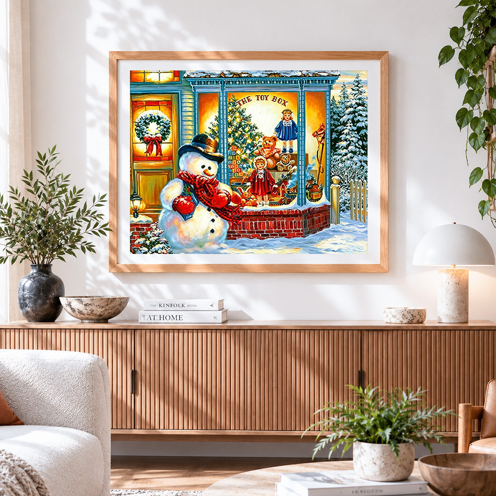 Finished snowman outside "the toy box" shop cross stitch artwork displayed