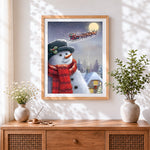 Finished snowman watching santa's sleigh cross stitch artwork displayed