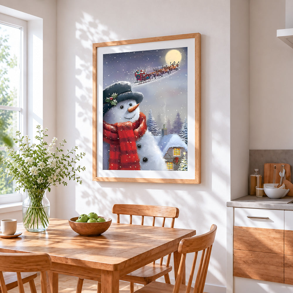 Snowman watching santa's sleigh cross stitch artwork displayed on wall as home decor