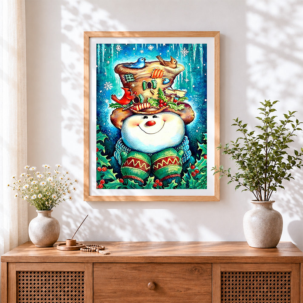 Finished snowman with decorated hat and winter birds cross stitch artwork displayed