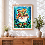 Finished snowman with decorated hat and winter birds cross stitch artwork displayed