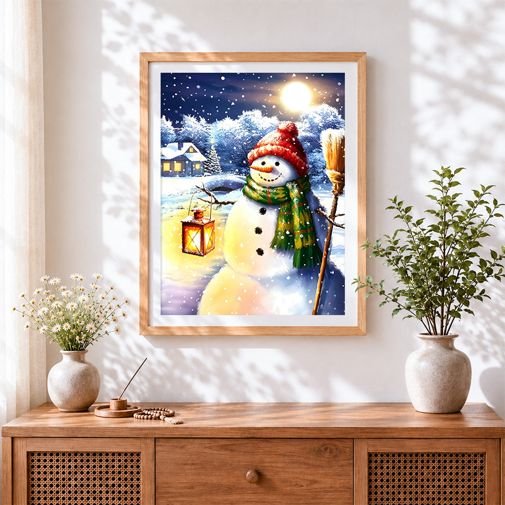 Finished snowman with lantern and broom cross stitch artwork displayed