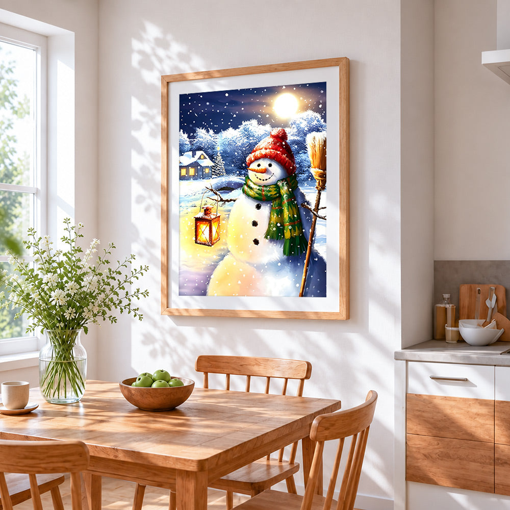 Snowman with lantern and broom cross stitch artwork displayed on wall as home decor