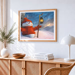 Snowman with lantern cross stitch artwork displayed on wall as home decor