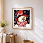 Snowman with red hat and snowflakes paint by numbers artwork displayed on wall as home decor
