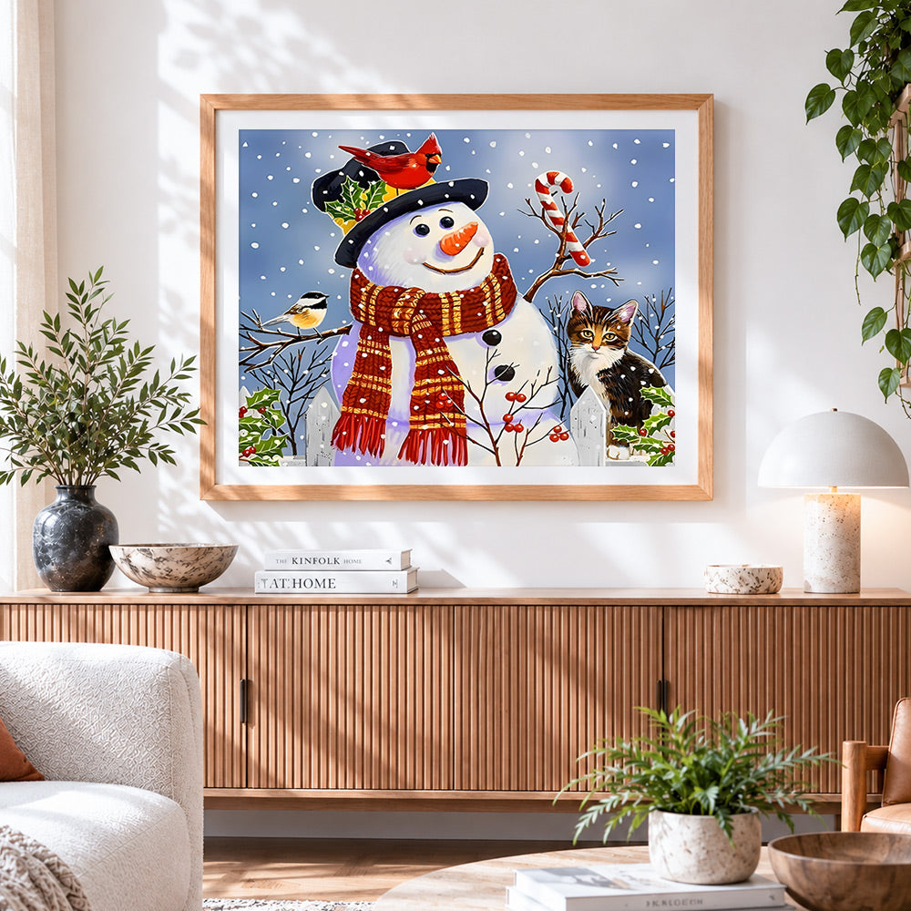 Finished snowman with robin and cat cross stitch artwork displayed