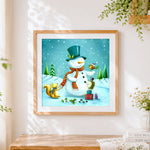 Finished snowman with squirrel and robin cross stitch artwork displayed