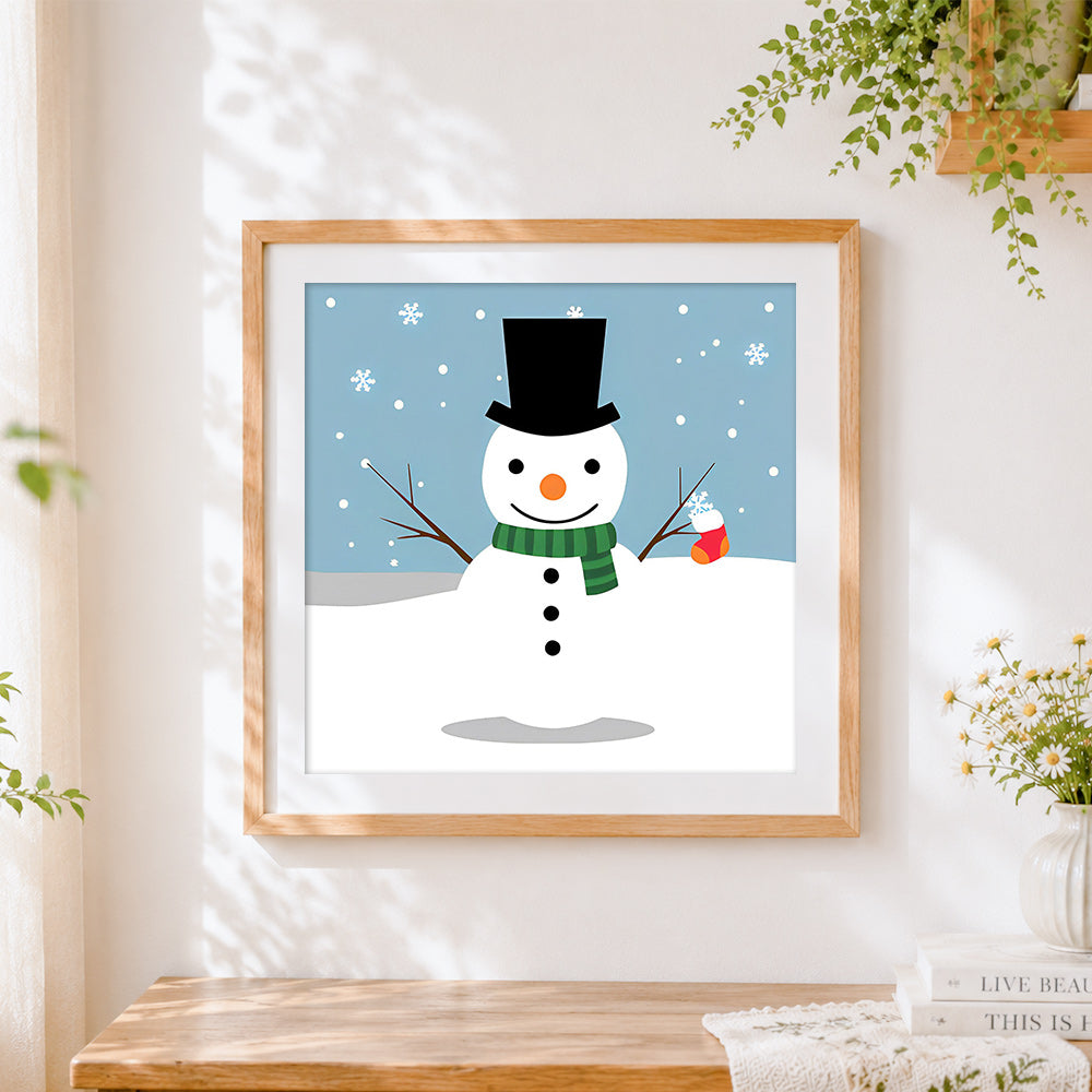 Finished snowman with top hat and green scarf cross stitch artwork displayed