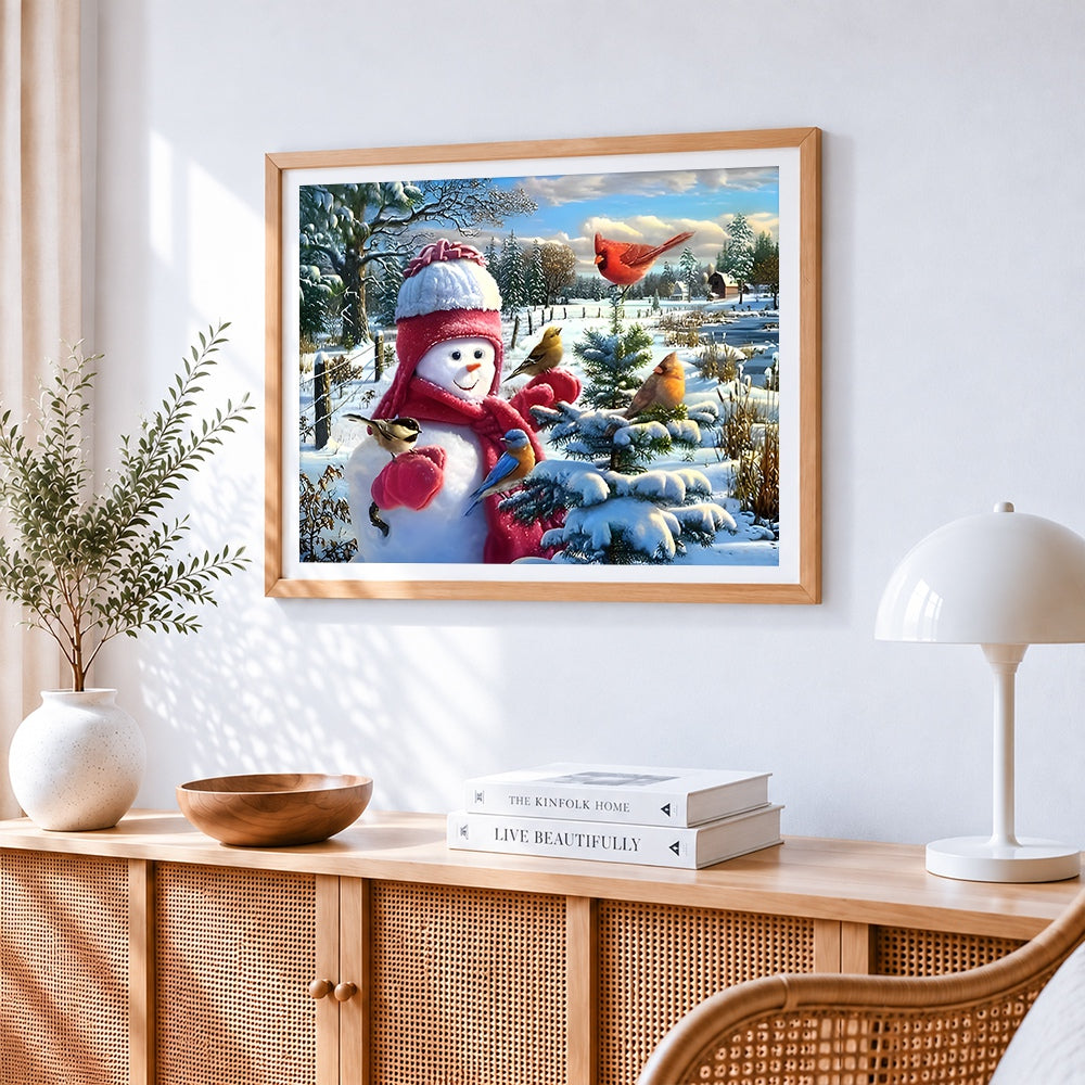 Snowman with winter birds cross stitch artwork displayed on wall as home decor