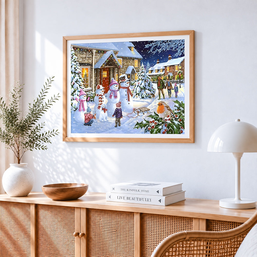 Snowmen and families in a festive village cross stitch artwork displayed on wall as home decor
