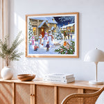 Snowmen and families in a festive village cross stitch artwork displayed on wall as home decor