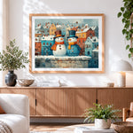 Finished snowmen in snowy town cross stitch artwork displayed