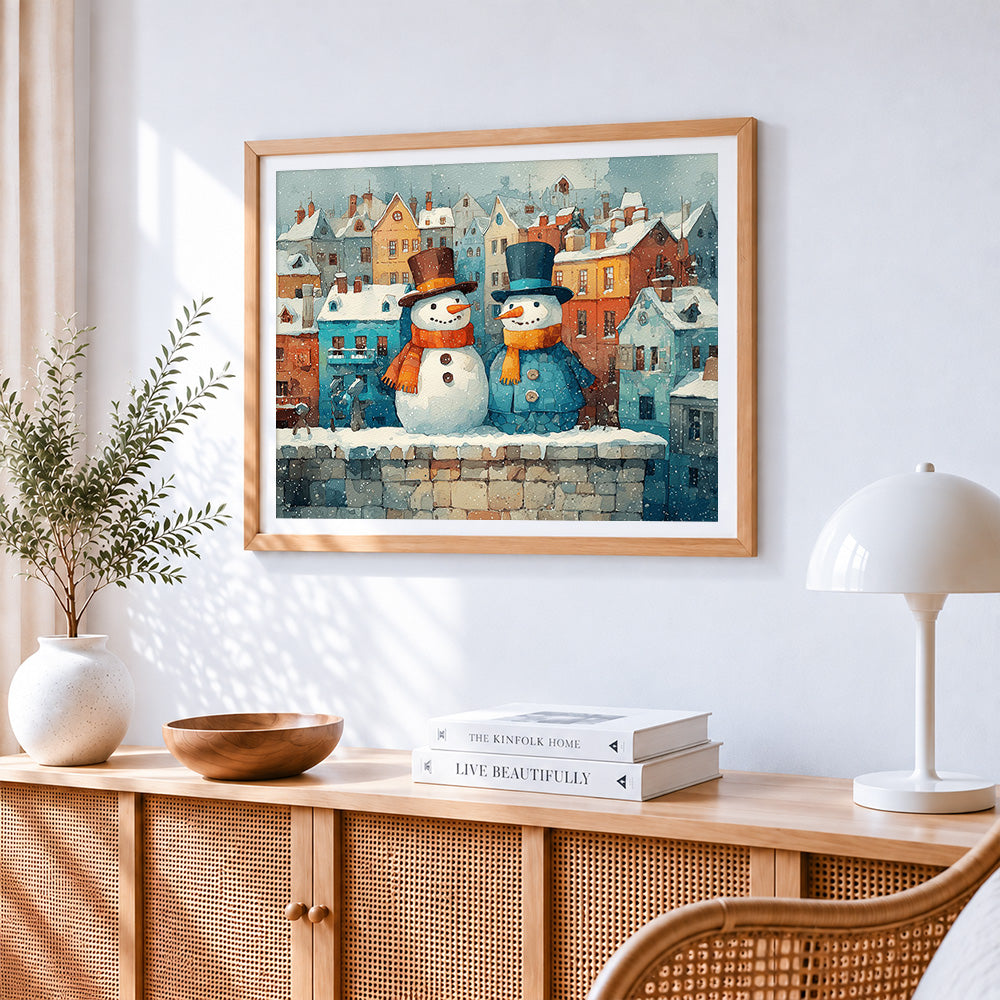 Snowmen in snowy town cross stitch artwork displayed on wall as home decor