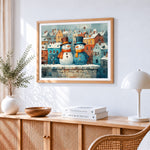 Snowmen in snowy town paint by numbers artwork displayed on wall as home decor