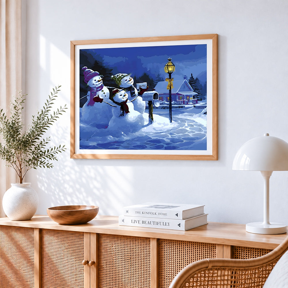 Snowmen posting a letter to santa cross stitch artwork displayed on wall as home decor