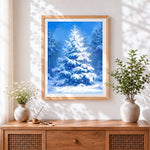 Finished snowy blue christmas tree cross stitch artwork displayed
